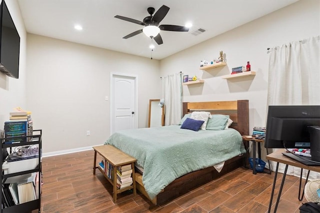 bedroom featuring ceiling fan and dark wood-type flooring