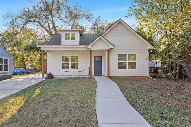 bungalow-style house with a front lawn