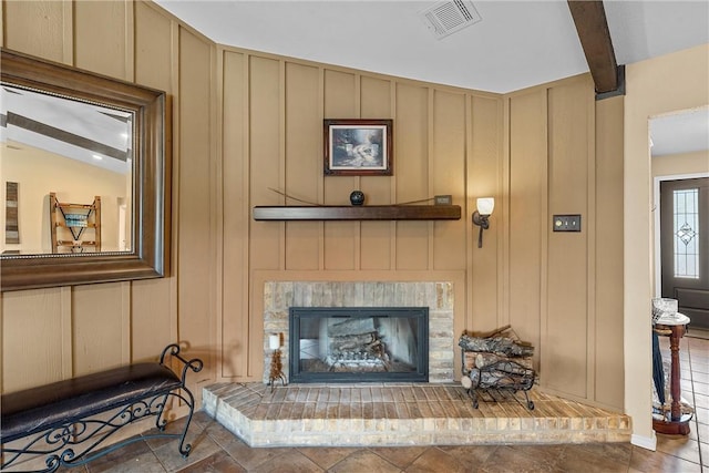 room details with beam ceiling and a fireplace