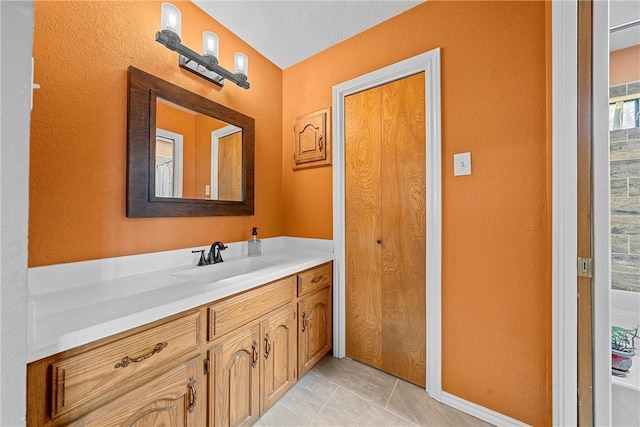 bathroom with tile patterned flooring and vanity