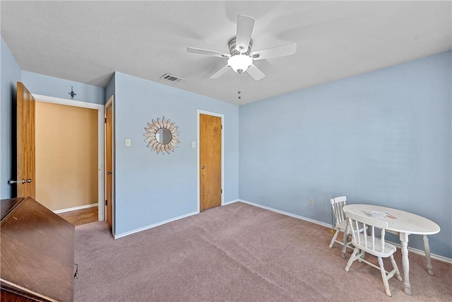 interior space with ceiling fan