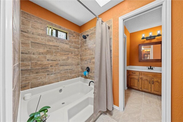 bathroom with tile patterned floors, vanity, and shower / bathtub combination with curtain