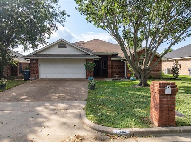 single story home with a garage and a front lawn