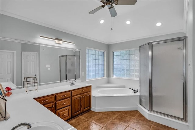 bathroom featuring ceiling fan, plus walk in shower, tile patterned floors, crown molding, and vanity