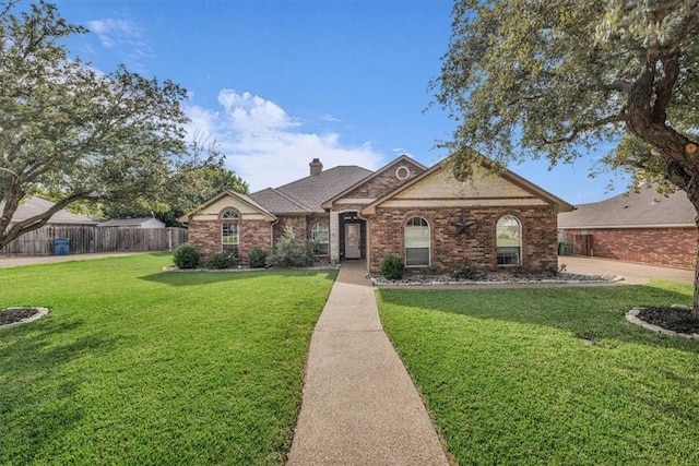 ranch-style home with a front lawn