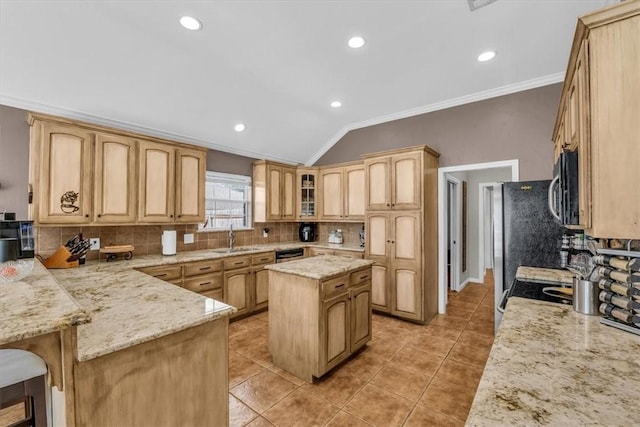 kitchen featuring a center island, crown molding, vaulted ceiling, a kitchen bar, and appliances with stainless steel finishes