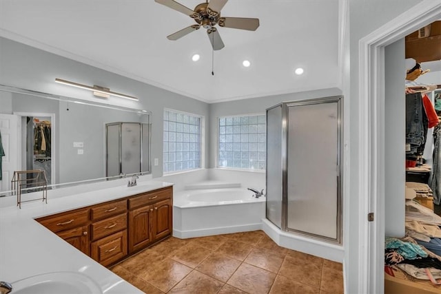 bathroom with vanity, tile patterned flooring, ceiling fan, ornamental molding, and independent shower and bath