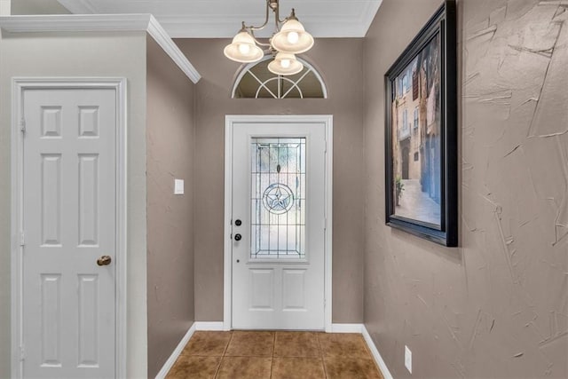 entryway featuring tile patterned floors, crown molding, and an inviting chandelier