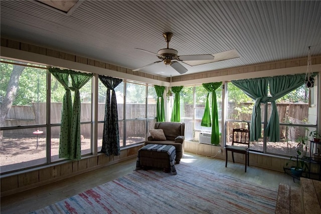 sunroom / solarium with a ceiling fan