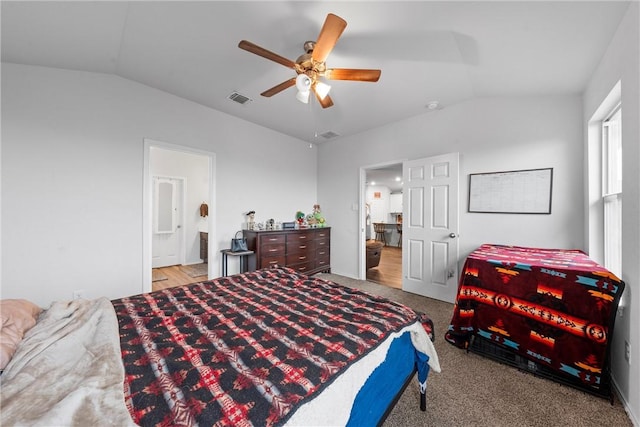 bedroom with lofted ceiling, ceiling fan, ensuite bath, and visible vents