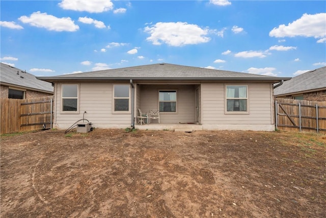 back of house featuring a patio area and a fenced backyard