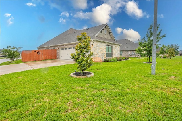 view of property exterior with a garage and a yard