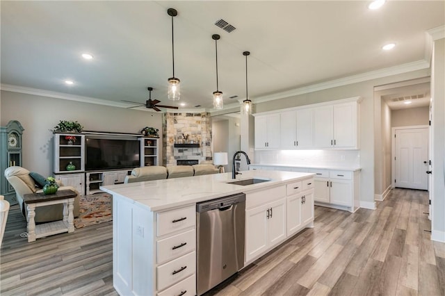 kitchen featuring white cabinetry, dishwasher, a center island with sink, and sink