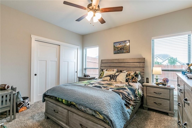 carpeted bedroom with ceiling fan