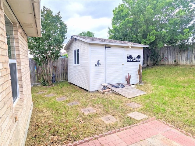 view of outdoor structure featuring a lawn