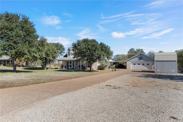 view of front of home featuring a storage shed