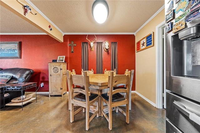 dining area with a textured ceiling, concrete floors, and ornamental molding