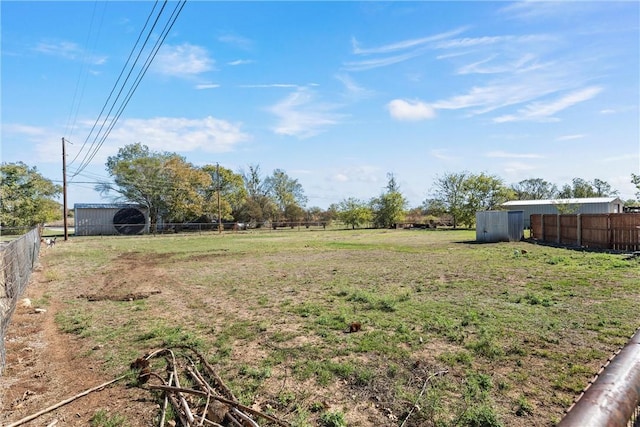 view of yard with a rural view