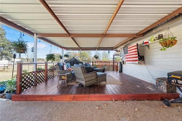 wooden terrace featuring an outdoor living space