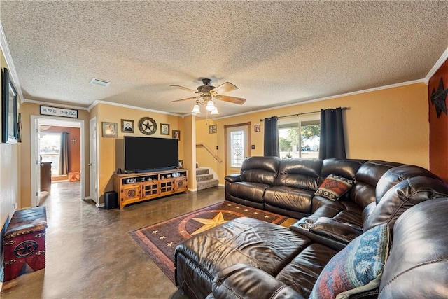 living room with a textured ceiling, ceiling fan, and ornamental molding