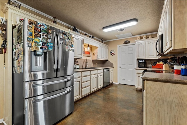 kitchen with sink, stainless steel appliances, a textured ceiling, and ornamental molding