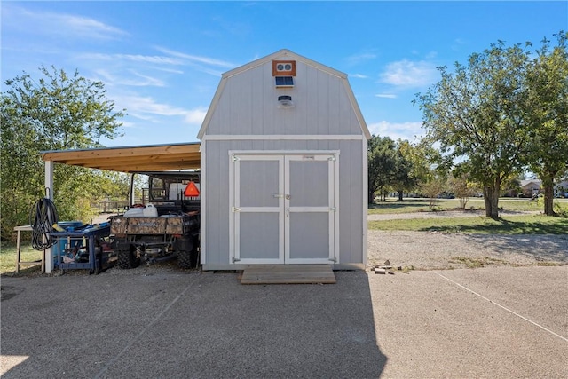 view of outdoor structure with a carport