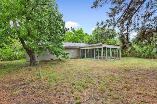 view of yard with a sunroom