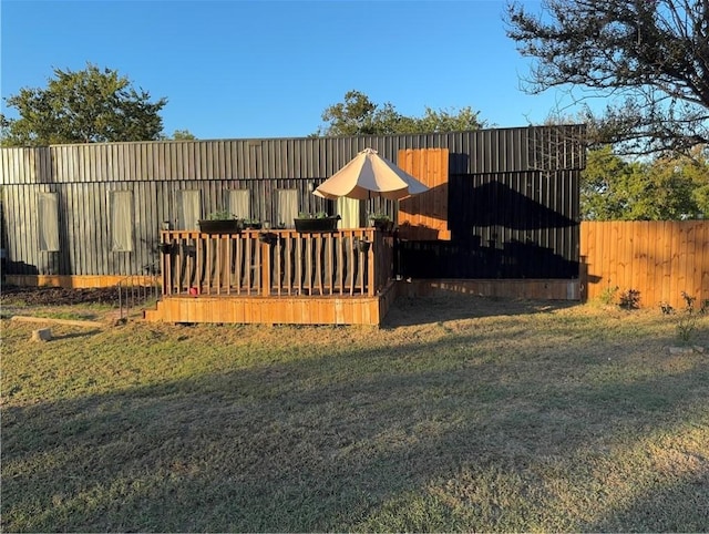 exterior space with a yard and a wooden deck