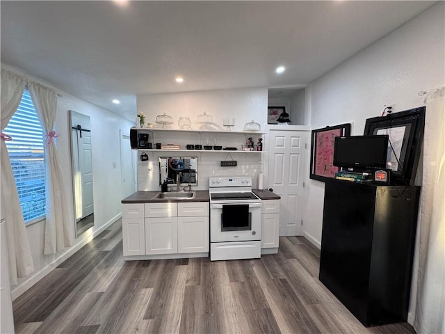 kitchen featuring sink, white cabinets, dark hardwood / wood-style floors, and white electric stove