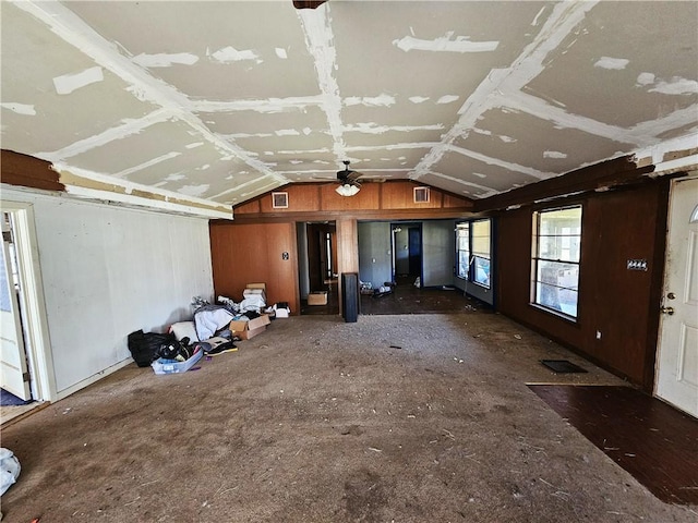 unfurnished living room featuring lofted ceiling and visible vents