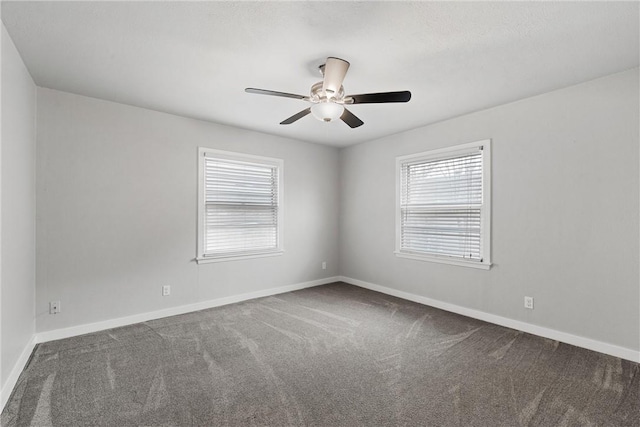 carpeted empty room featuring ceiling fan