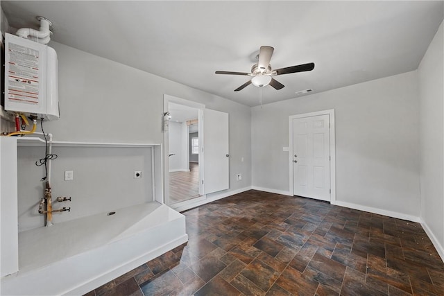 entryway with ceiling fan and water heater