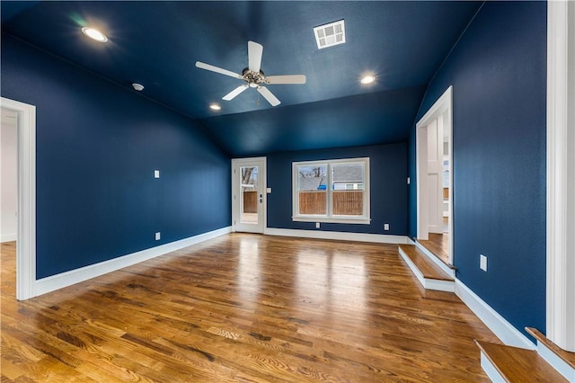 interior space featuring ceiling fan, hardwood / wood-style floors, and vaulted ceiling