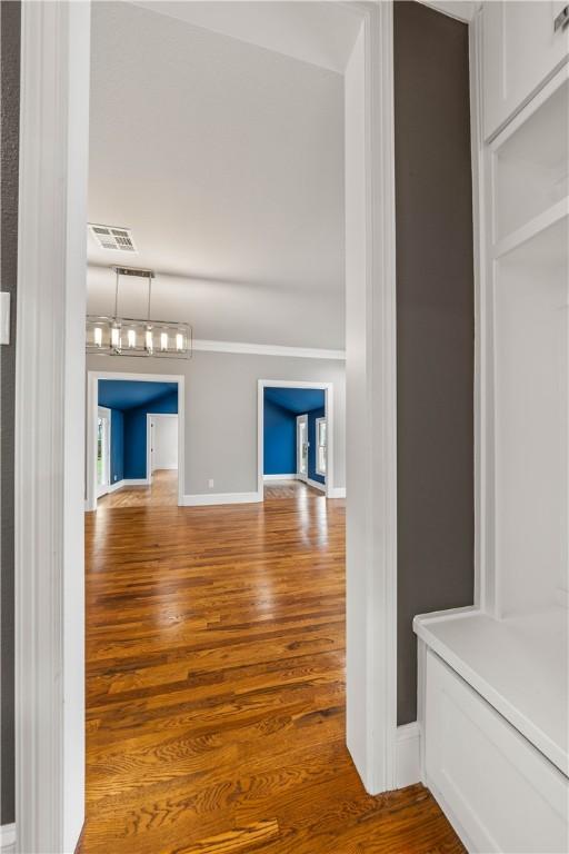 unfurnished living room featuring wood-type flooring