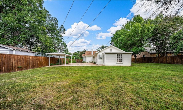 view of yard featuring an outbuilding and a patio