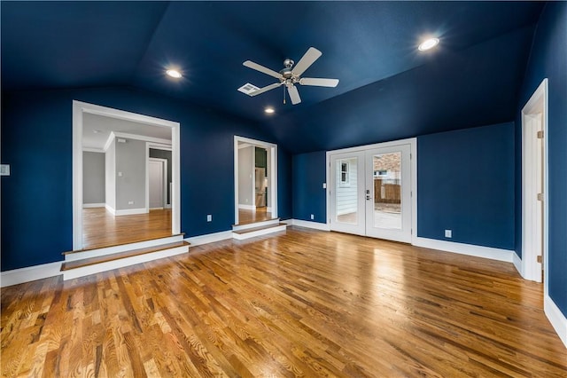 interior space featuring ceiling fan, french doors, lofted ceiling, and hardwood / wood-style flooring