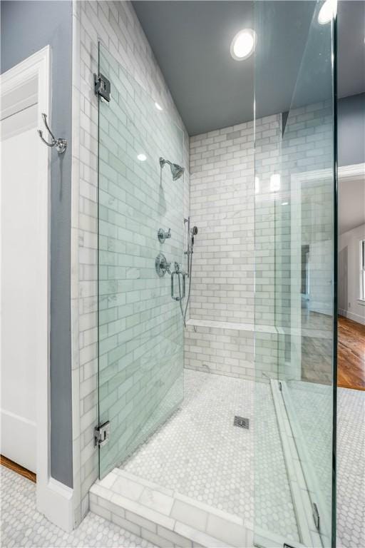 bathroom featuring tile patterned floors and an enclosed shower