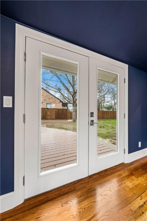 entryway featuring hardwood / wood-style floors and french doors