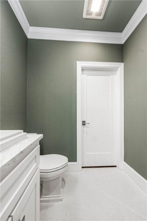 bathroom with toilet and crown molding