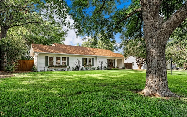 ranch-style house with a front yard