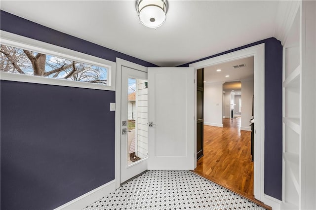 foyer entrance with light wood-type flooring