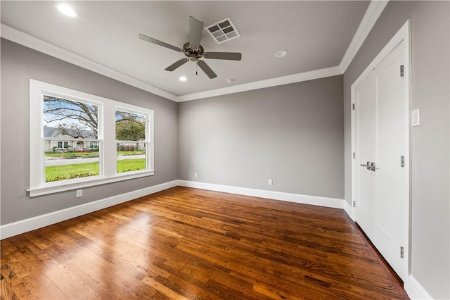 unfurnished bedroom with ceiling fan, dark wood-type flooring, and ornamental molding