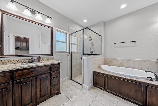 bathroom with vanity, tile patterned flooring, and separate shower and tub