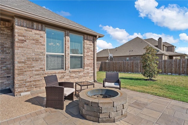 view of patio / terrace with an outdoor fire pit