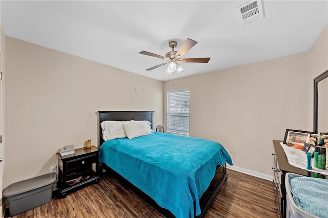 bedroom with ceiling fan and dark hardwood / wood-style floors