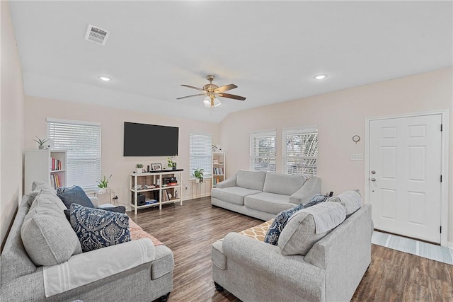 living room featuring ceiling fan, dark hardwood / wood-style flooring, and lofted ceiling