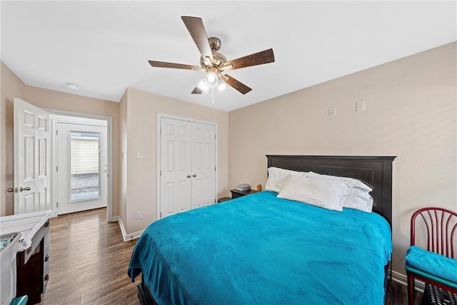 bedroom featuring ceiling fan, dark wood-type flooring, and a closet