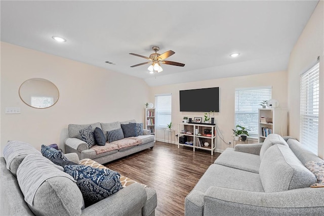 living room with ceiling fan, dark hardwood / wood-style flooring, and lofted ceiling