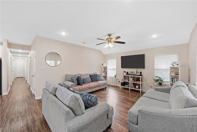 living room featuring dark hardwood / wood-style floors, ceiling fan, and plenty of natural light