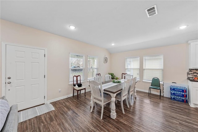 dining area with dark hardwood / wood-style floors and a healthy amount of sunlight